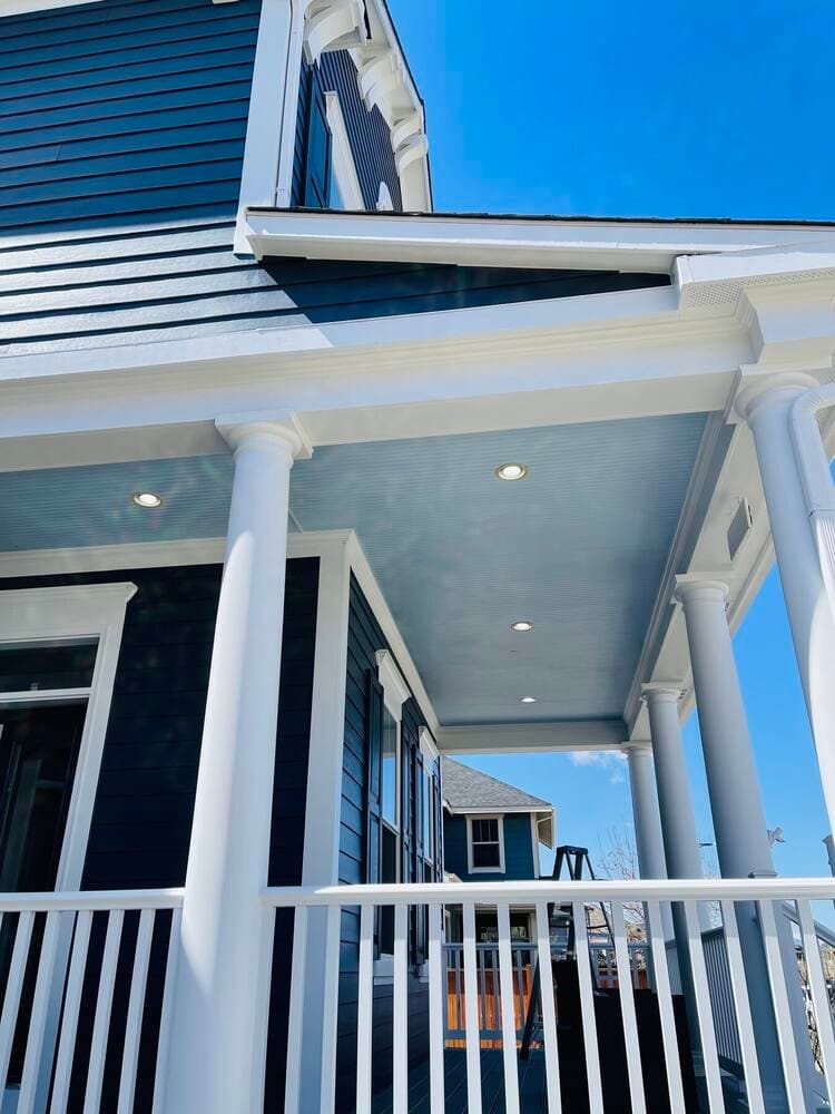 Freshly painted porch columns and ceiling detail