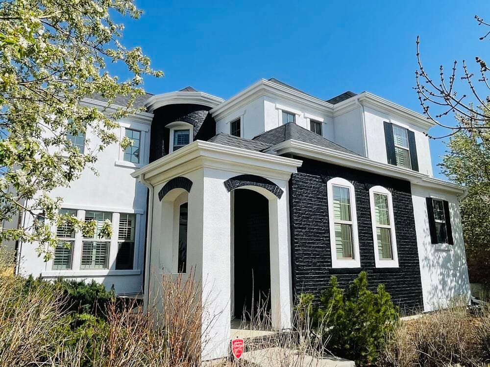Two story stucco and brick exterior repaint